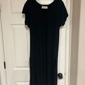 Black mid length dress or beach cover up.
